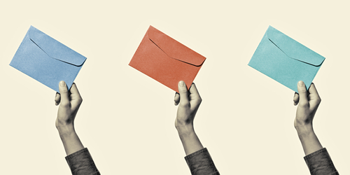 Hands holding different coloured envelopes on a pale yellow background